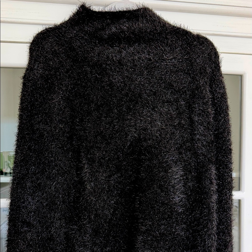 Soft cosy sweater from Calvin Klein. Black with a little sparkle. Size Small.